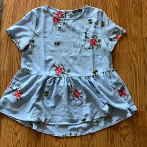 Baby blue peplum top with embroidered flowers